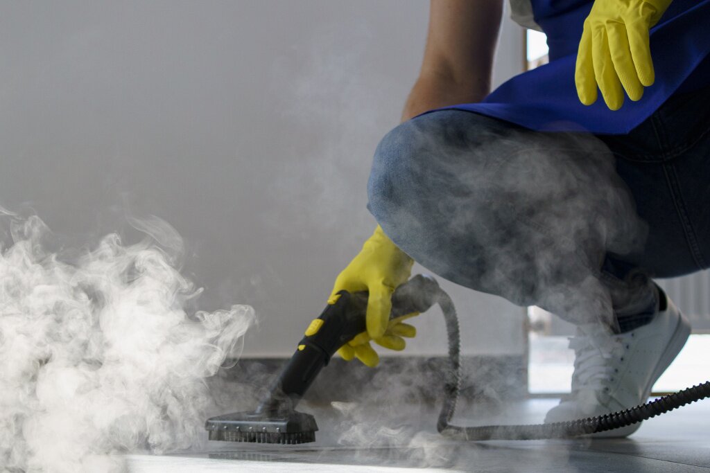 дезинфекция professional-cleaning-service-person-using-steam-cleaner-office.jpg