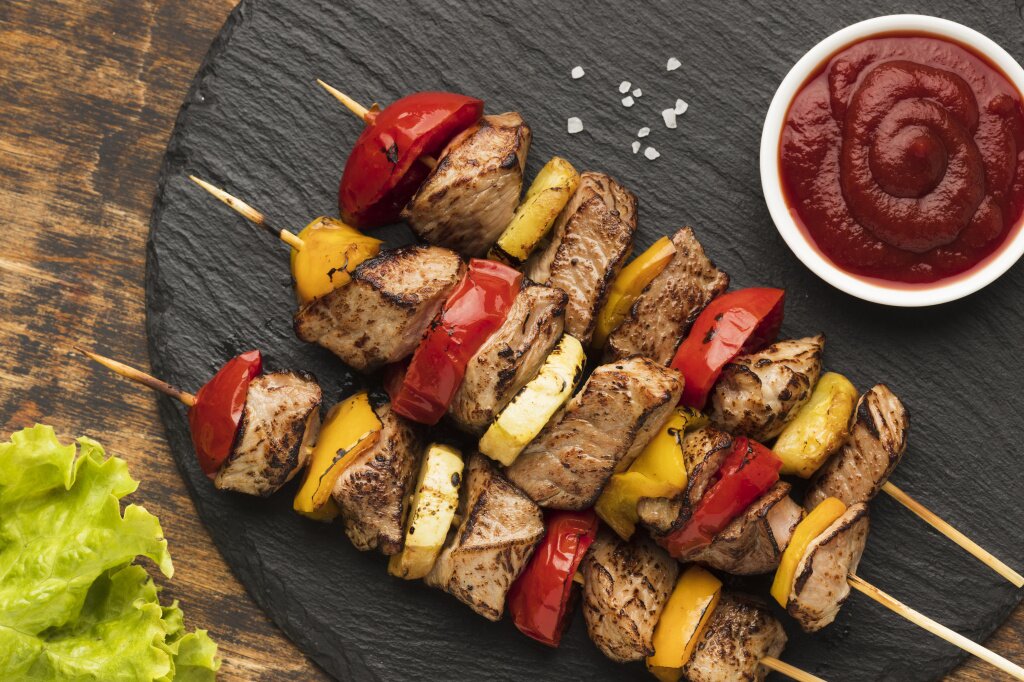 top-view-delicious-kebab-slate-with-salad-ketchup.jpg