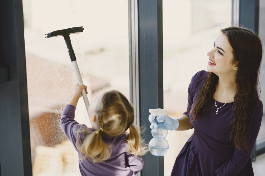 daughter-mother-cleaning-window-together.jpg