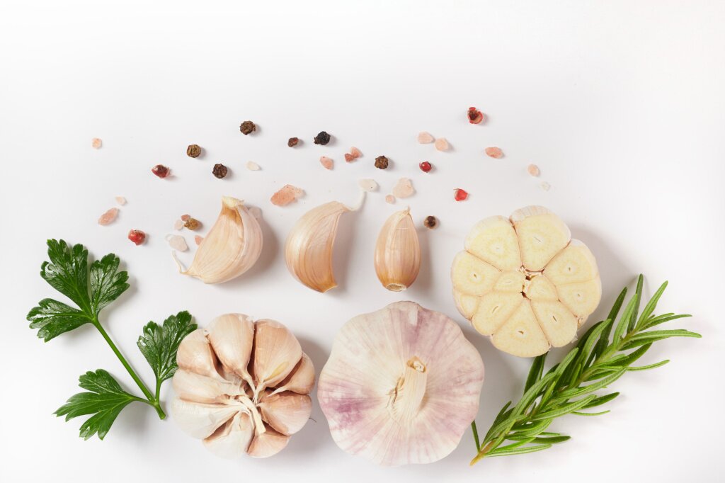 garlic-with-rosemary-parsley-peppercorn-isolated-white-surface-top-view-flat-lay-freshly-picked-from-home-growth-organic-garden-food-concept.jpg