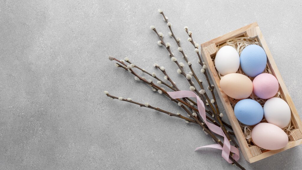 flat-lay-box-with-colorful-easter-eggs-copy-space.jpg