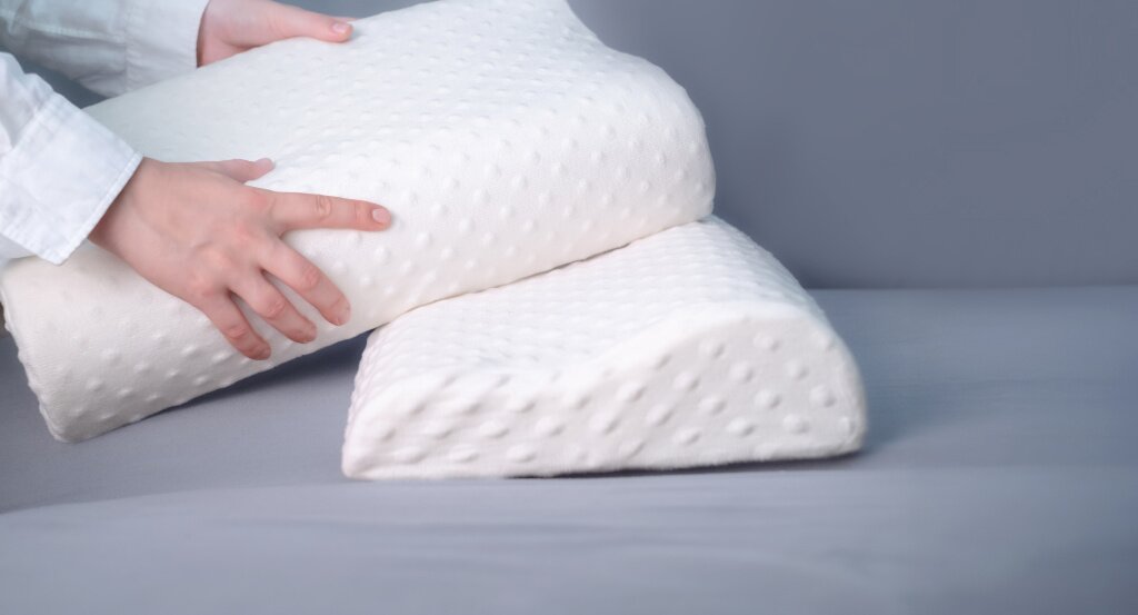 подушки women-s-hands-holding-memory-foam-pillows-showcasing-quality-sleep-support-office.jpg