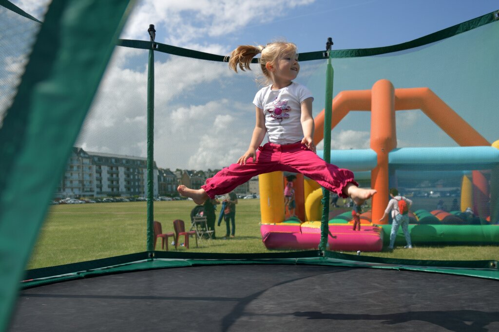 girl-fuchsia-pants-jumping-trampoline.jpg