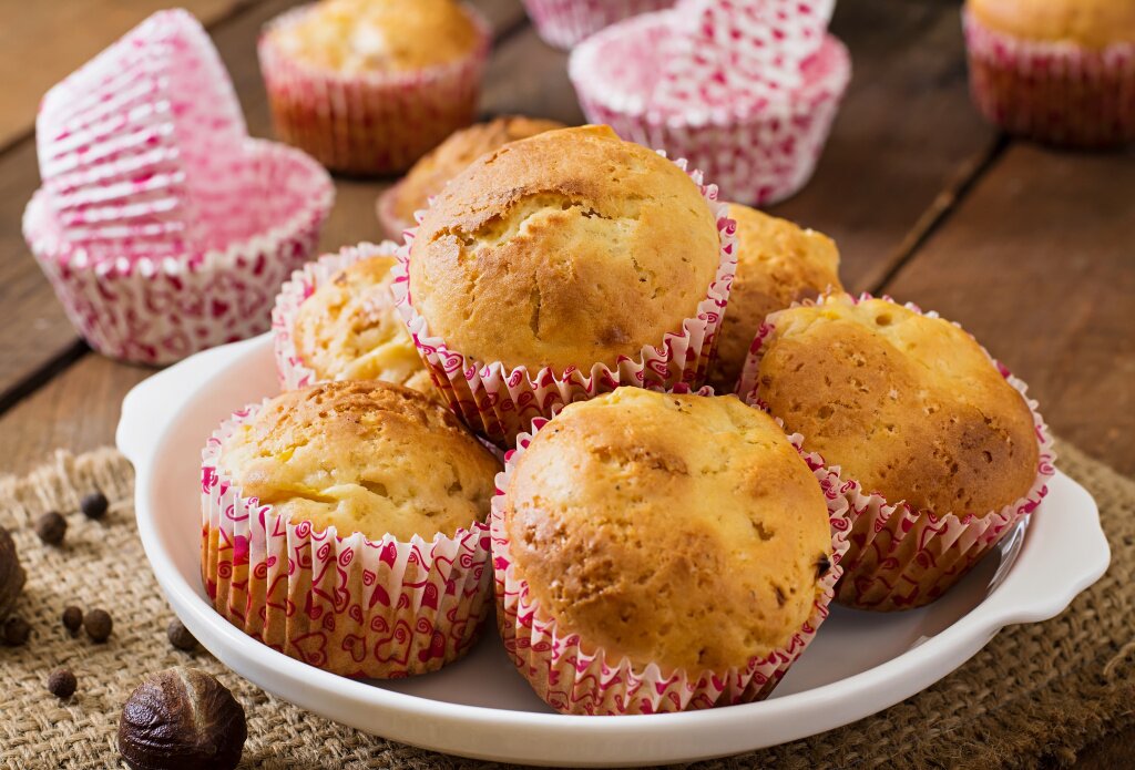 fruit-muffins-with-nutmeg-allspice-wooden-table.jpg