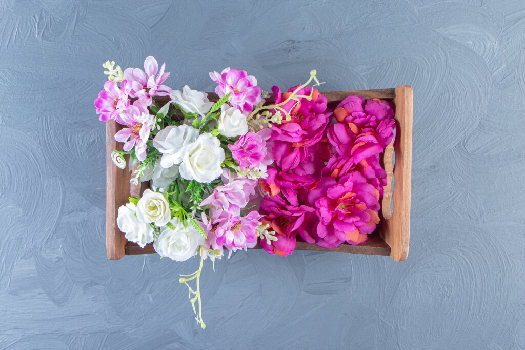 various-flowers-box-white-table.jpg