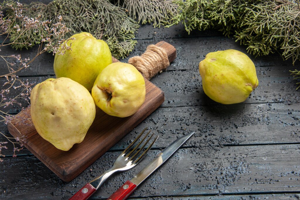 айва front-view-fresh-ripe-quinces-sour-fruits-dark-blue-rustic-desk-plant-fruit-tree-ripe-fresh.jpg