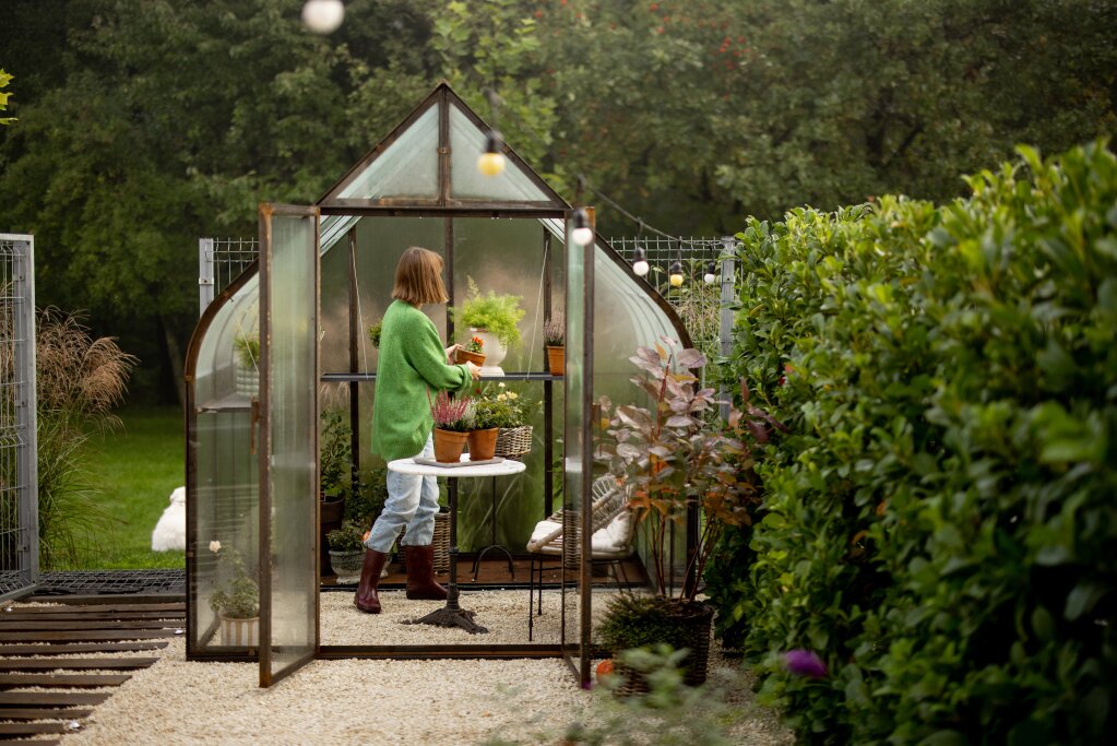 woman-with-plants-greenhouse.jpg