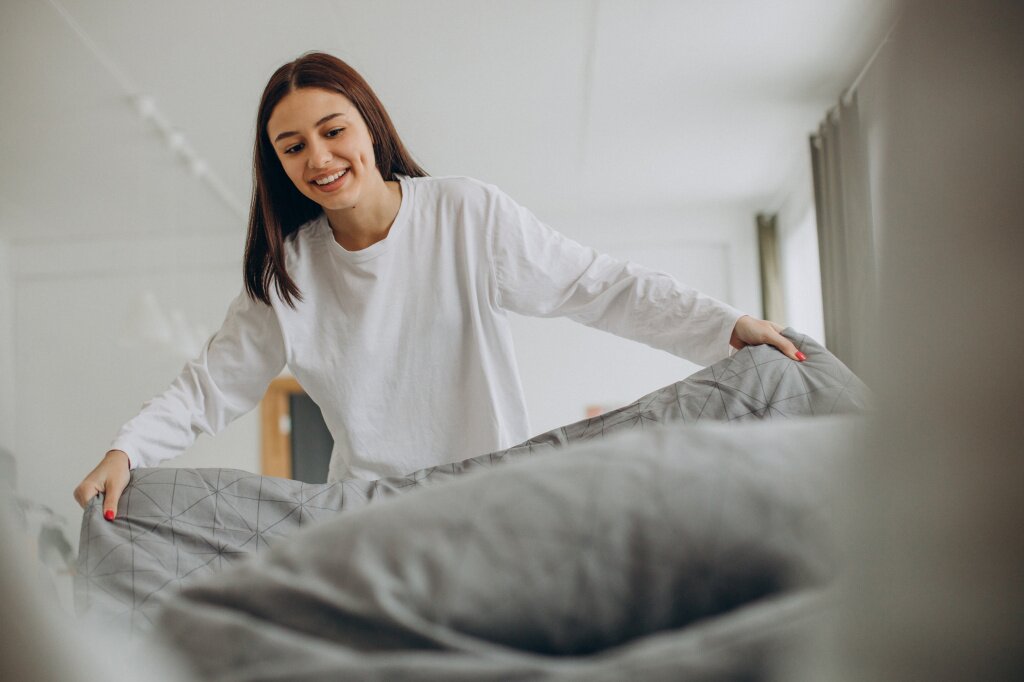 woman-making-her-bed-after-sleep-morning.jpg