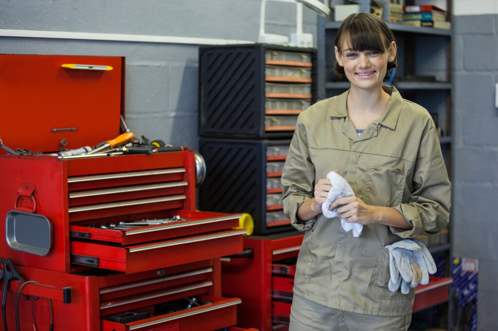 female-mechanic-standing-beside-tool-kit-repair-garage.jpg