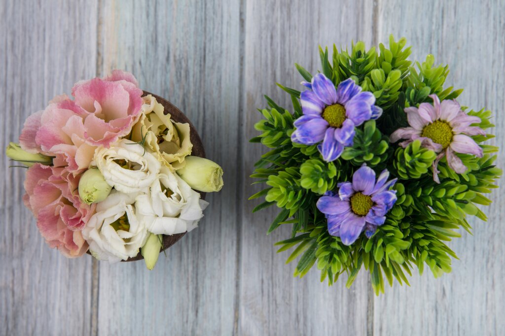 top-view-colorful-amazing-flowers-wooden-bowl-with-daisy-flowers-gray-wooden-background.jpg