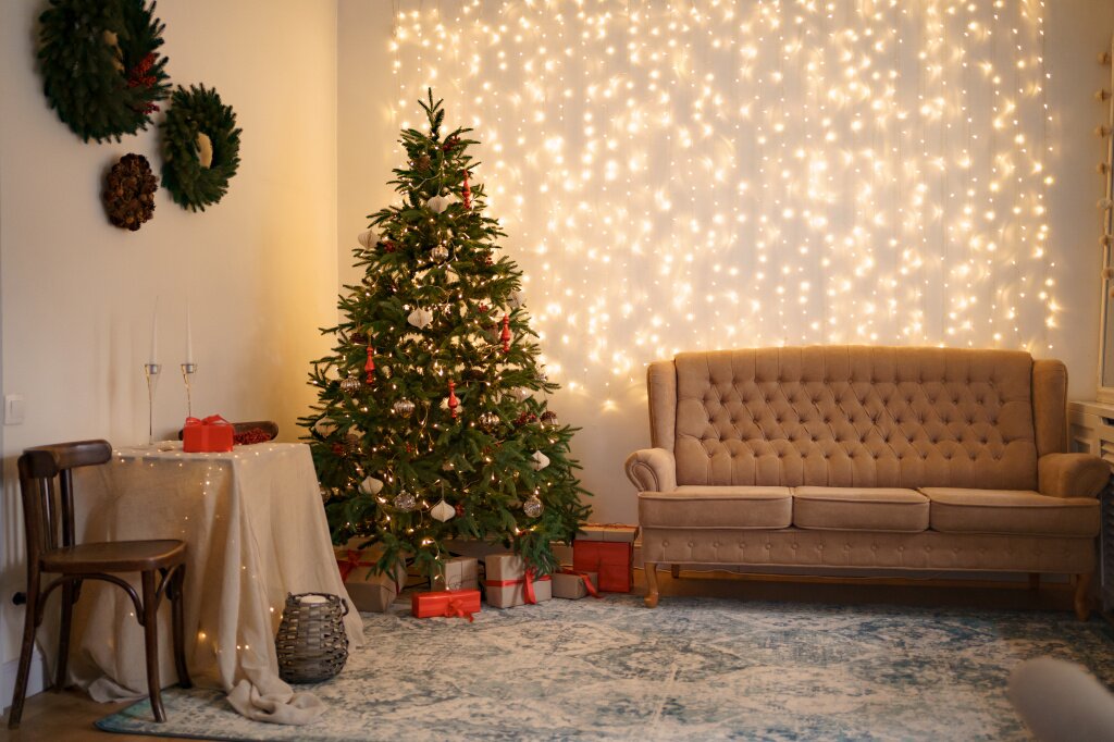 festive-interior-with-comfortable-sofa-decorated-christmas-tree.jpg