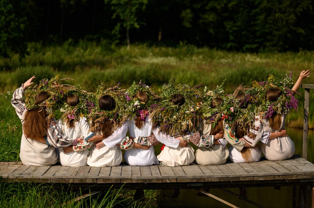 girls-woven-wreaths-various-flowers-grass-warm-summer-day-ivan-kupala-holiday.jpg