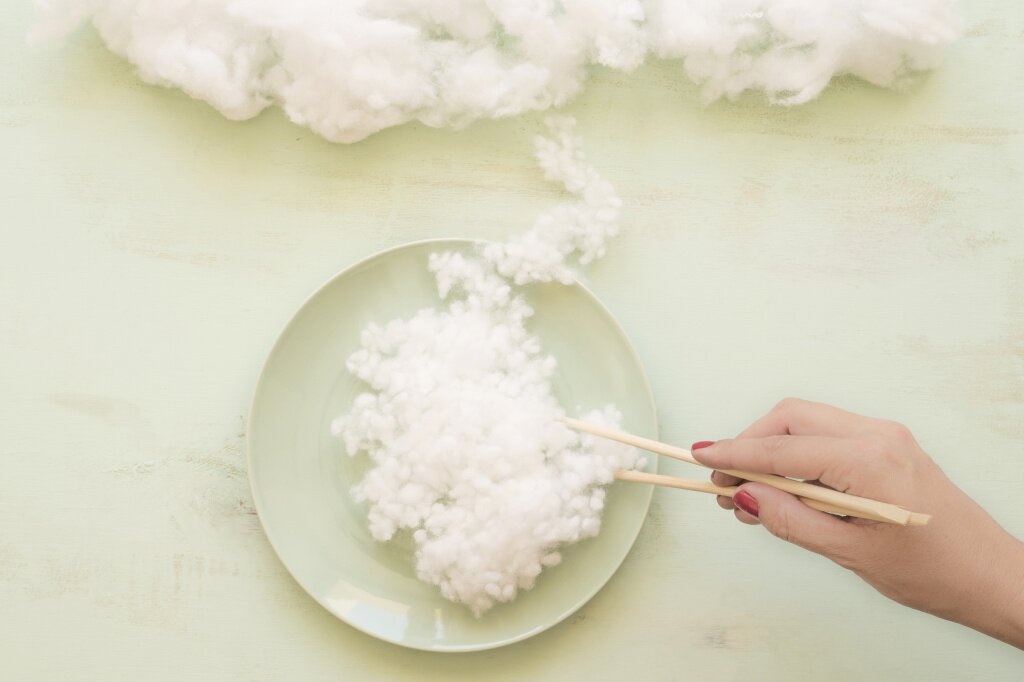 woman-hand-holding-white-cloud-with-chopsticks.jpg