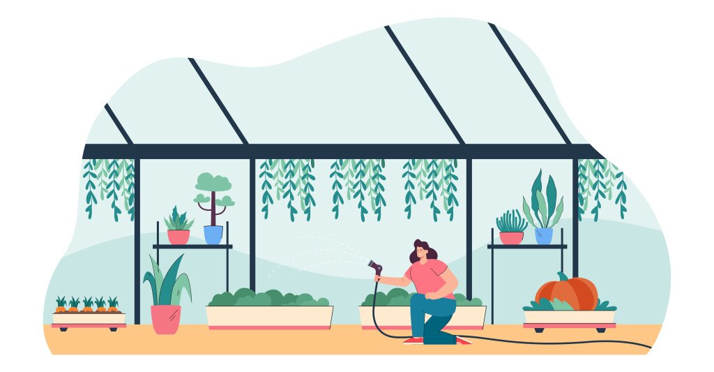 Gardener watering plants with greenhouse equipment.jpg