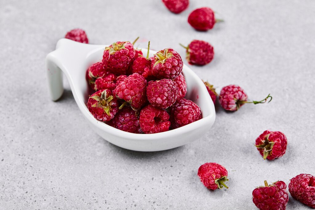 fresh-red-raspberries-white-bowl-white-surface.jpg