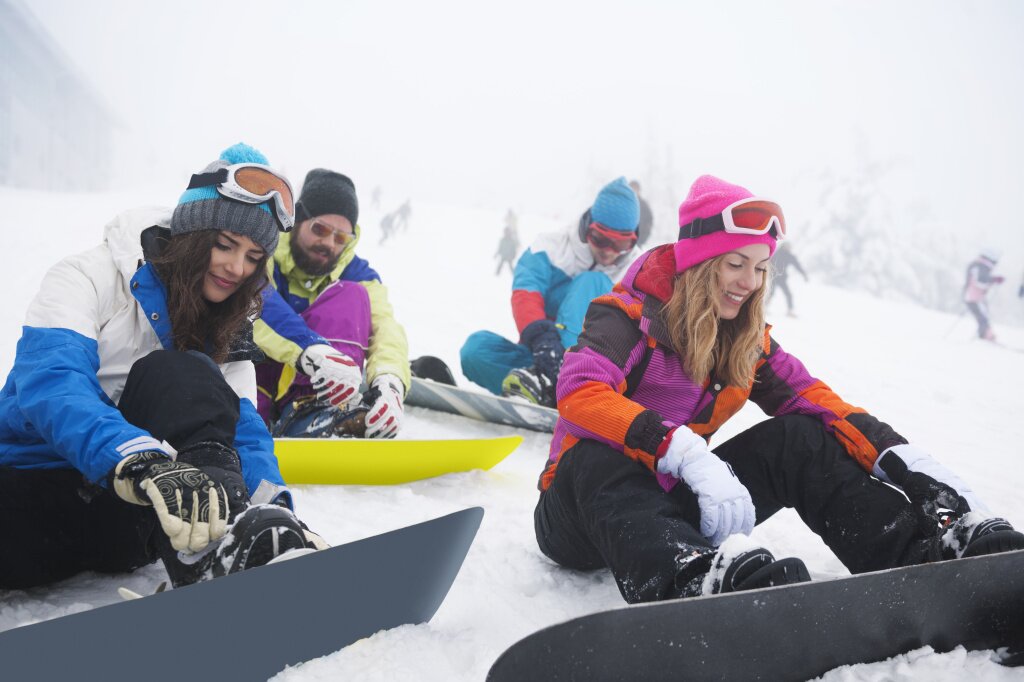 two-couples-having-fun-snowboarding.jpg